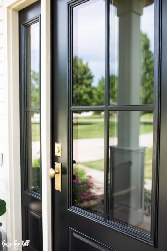 Black Four Pane Front Door with Brass Doorknob