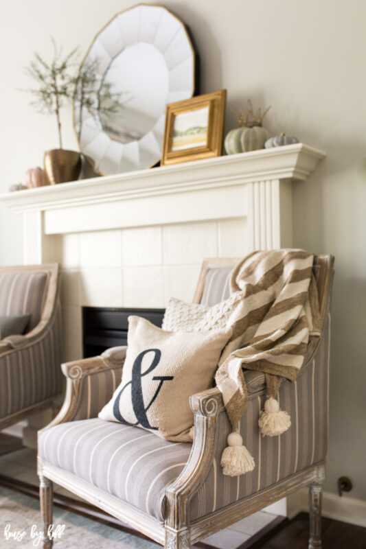 Neutral living room with fall decor and gold accents