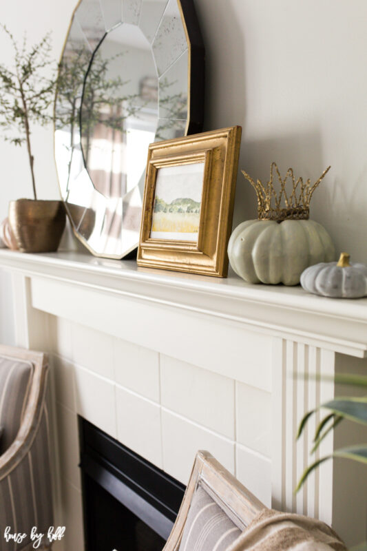 Thyme topiary in bronze pot, gold mirror, and watercolor on mantel