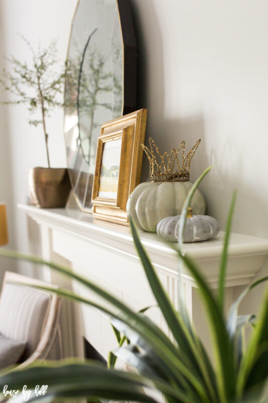 Neutral living room with fall decor and gold accents