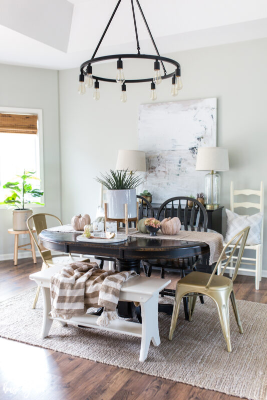 Dining room with modern art and neutral fall decor