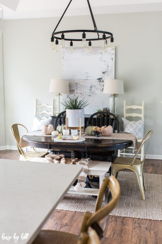 Dining room with modern art and neutral fall decor