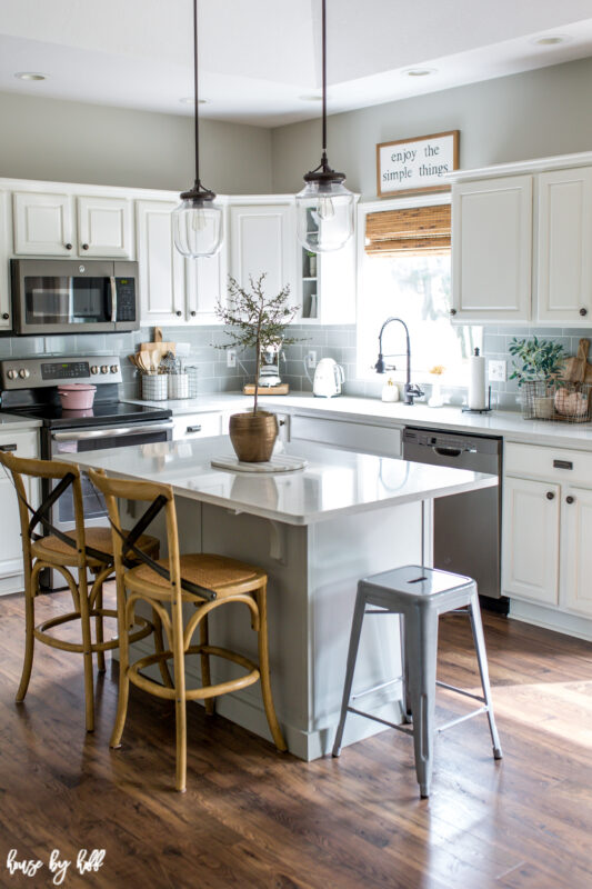 Kitchen with white quartz countertops and white cabinets