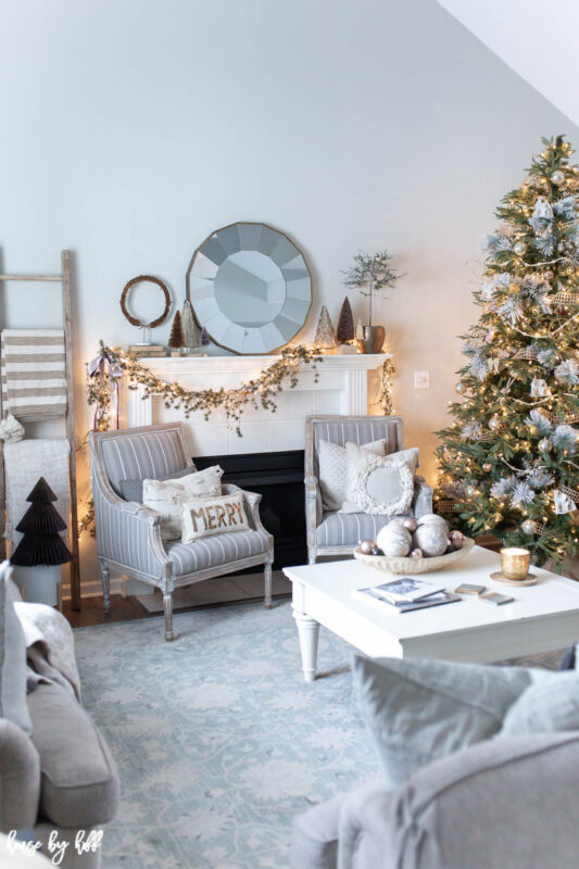 Elegant Holiday Living Room with Asymmetrical Mantel Garland 