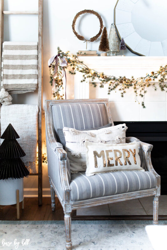Elegant Holiday Living Room with Asymmetrical Mantel Garland 