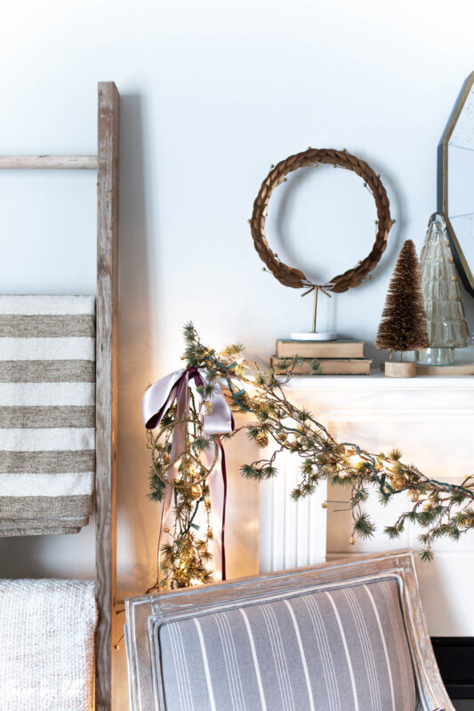 Elegant Holiday Living Room with Asymmetrical Mantel Garland 