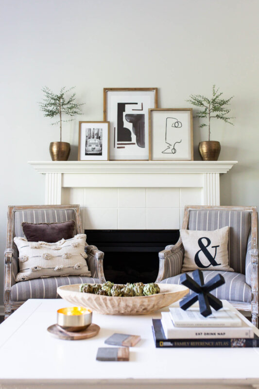 Black and white artwork on mantel