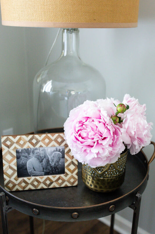 Pretty side table with peonies and frame