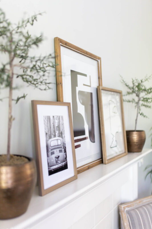 Mantel with black and white artwork