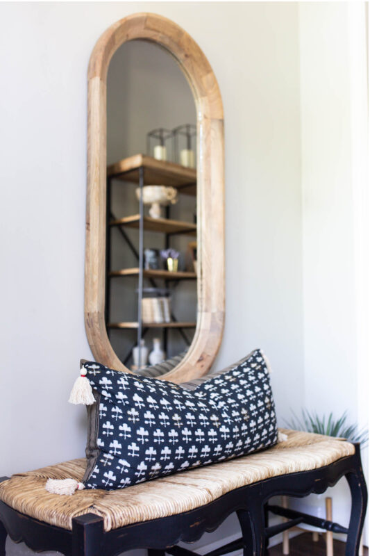 Small foyer with wood mirror and bench