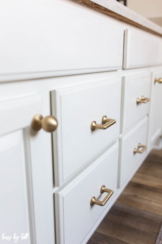 Brass Knobs and Pulls on White Bathroom Cabinets