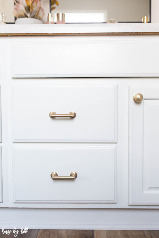 Brass Knobs and Pulls on White Bathroom Cabinets