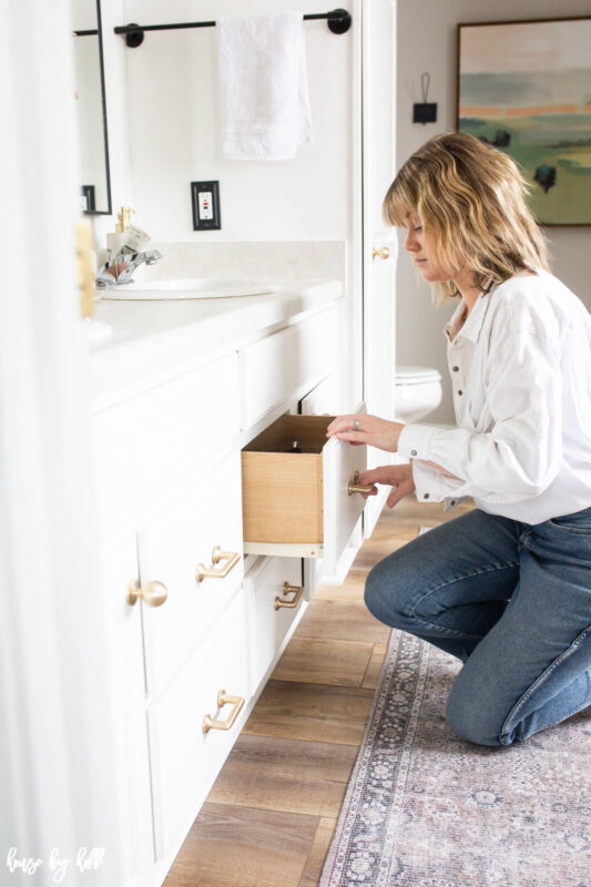 Brass Pulls on White Bathroom Cabinets